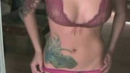 Sexy female body with tattoos