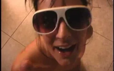 Girl in sunglasses takes a cum load in her face