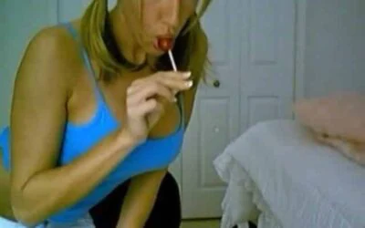 Marissa seductively sucks a lollipop