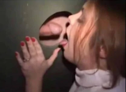 Redhead Woman Mouth Open for Cock at Gloryhole