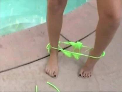 Bikini bottom around her ankles