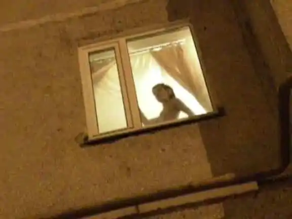 Naked girl showing off in the window