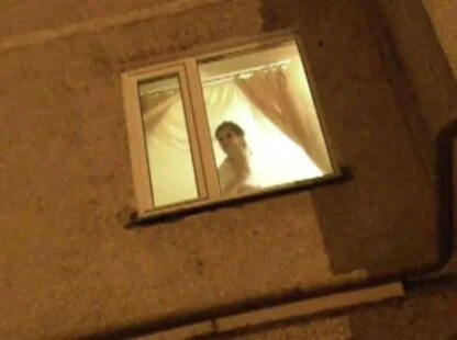 Girl in Her Window Knows a Voyeur is Watching Her