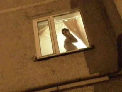 Nude Woman in Window Knew She Was Being Watched