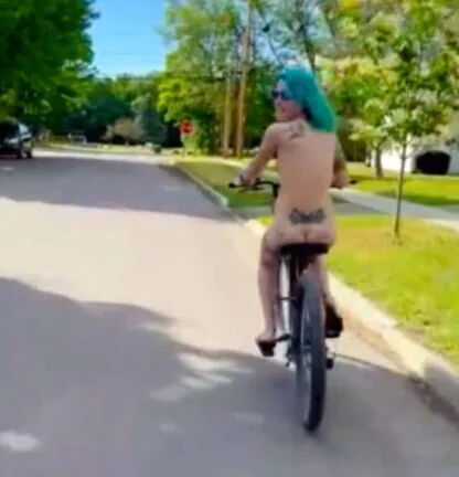 Nude Biking Girl Looks Back