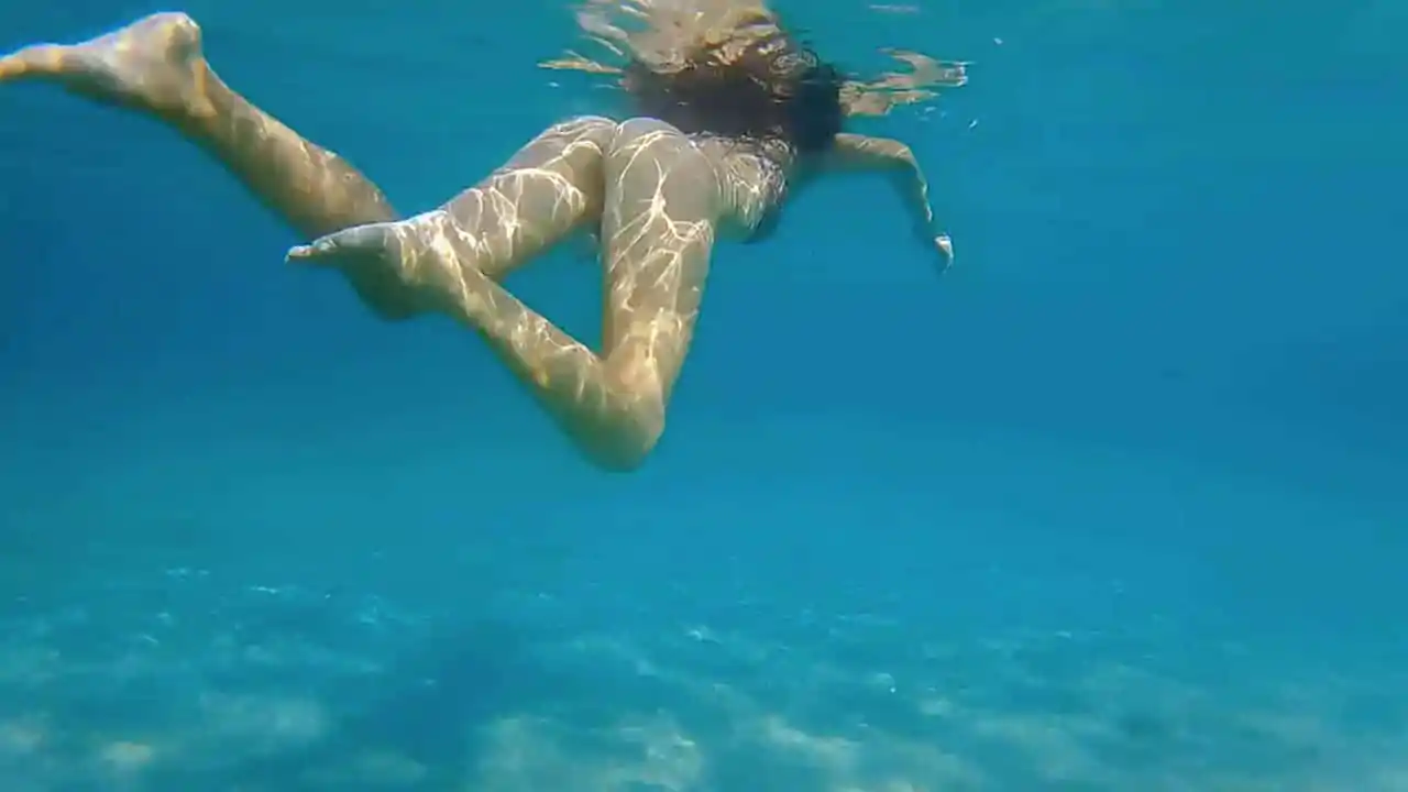 Bottomless Woman Swimming