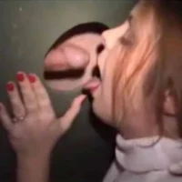 Redhead Woman Mouth Open for Cock at Gloryhole