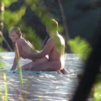 Blonde fucked from behind on beach seen by voyeurs