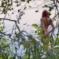Lone Naked Woman Playing at the River Caught by a Voyeur